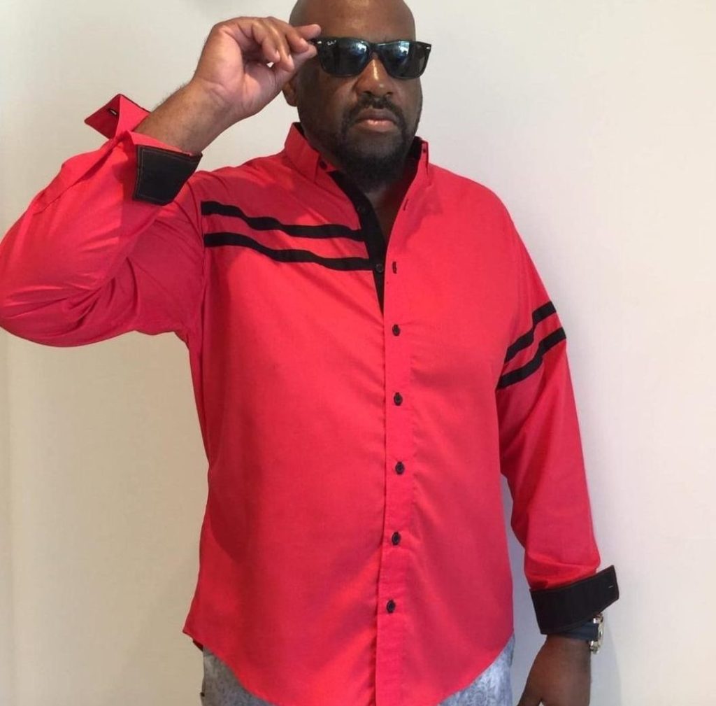 Man wearing red shirt sunglasses
